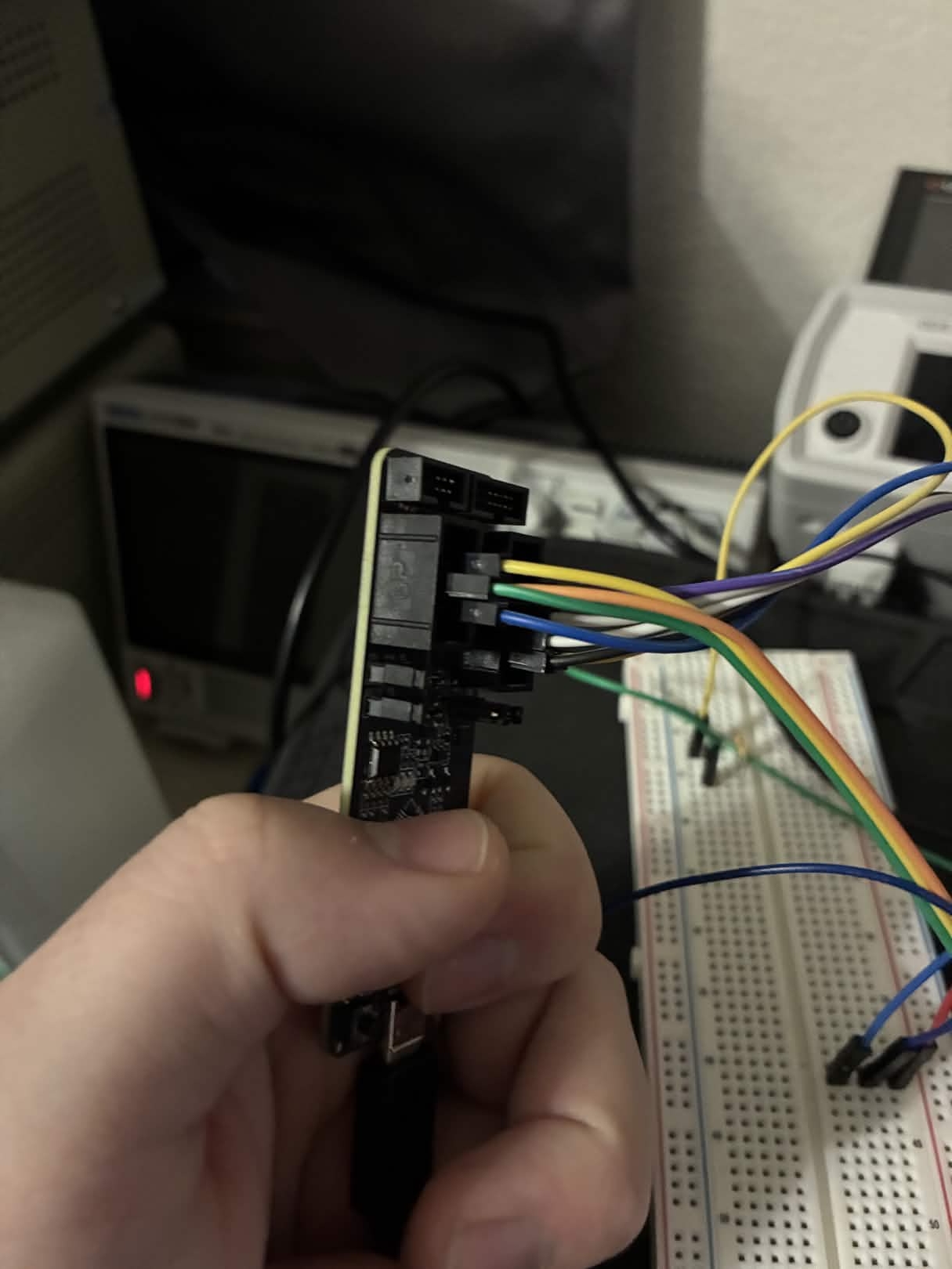 ESP-Prog side view showing both connectors with wires to breadboard